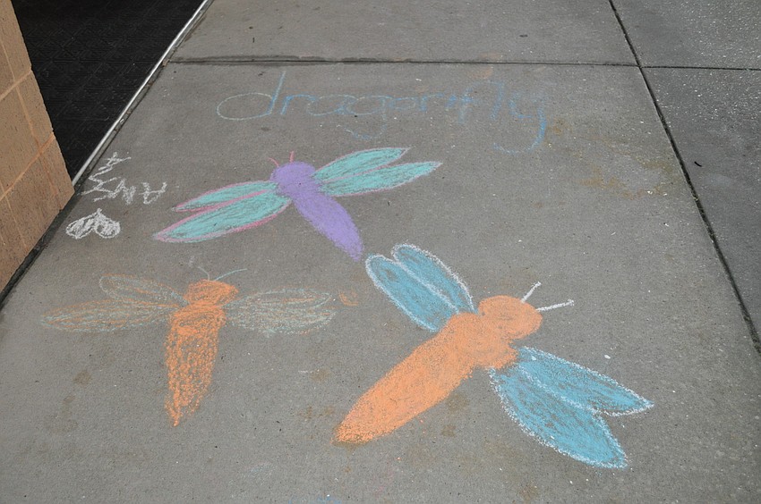 Booker Middle School's sidewalks were covered in chalk drawers promoting the cafe