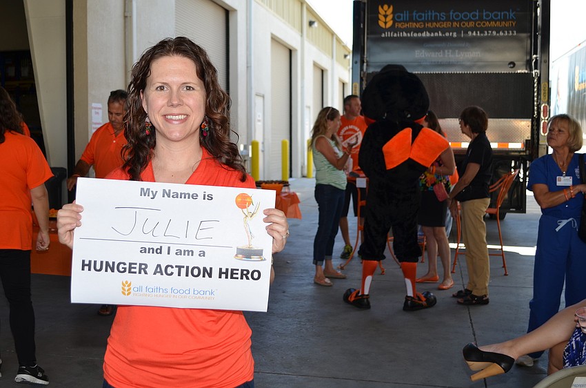 Julie Smith with her Hunger Action Hero sign.