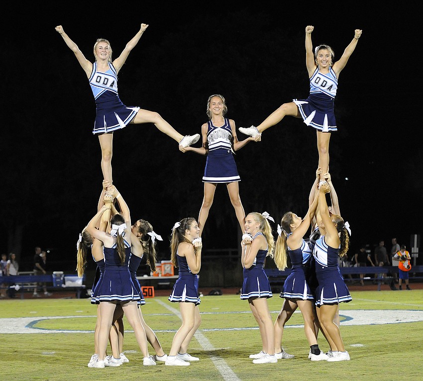 The Out-of-Door Academy varsity cheerleading squad entertained the crowd during halftime.
