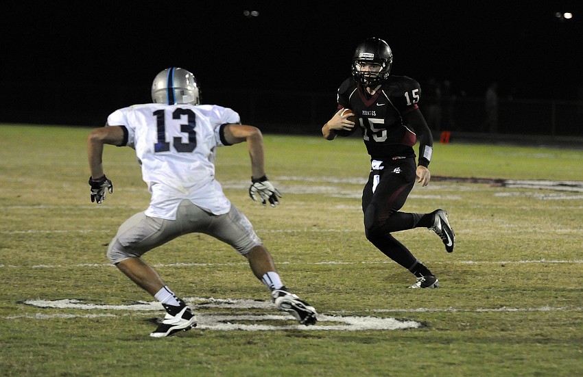 Braden River quarterback Dusty Peebles scrambles for yardage in the first half.