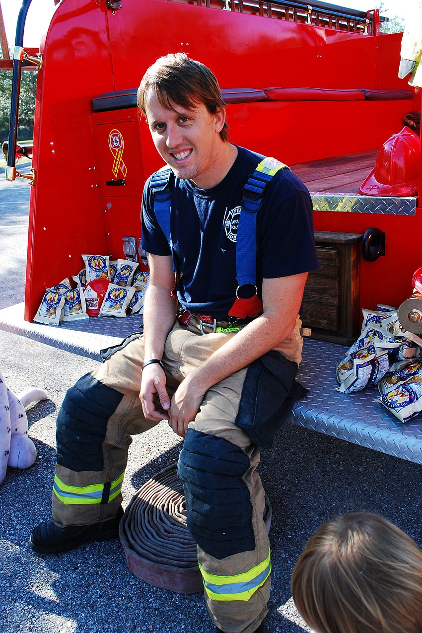 Fireman Sean Rowe brought out a fire truck provided by the Sarasota Firefighter Benevolence Fund.