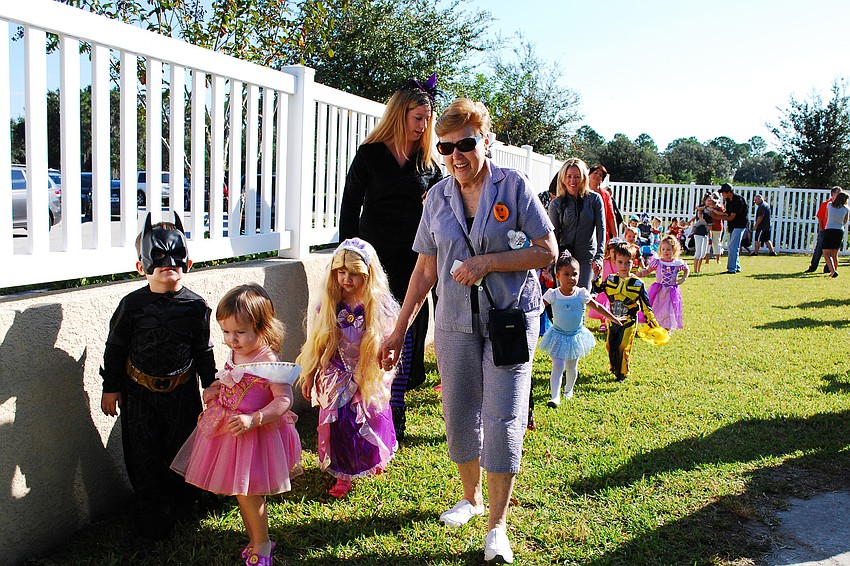 Children, with their parents and teachers, marched around The Goddard Schoolâ€™s playground.