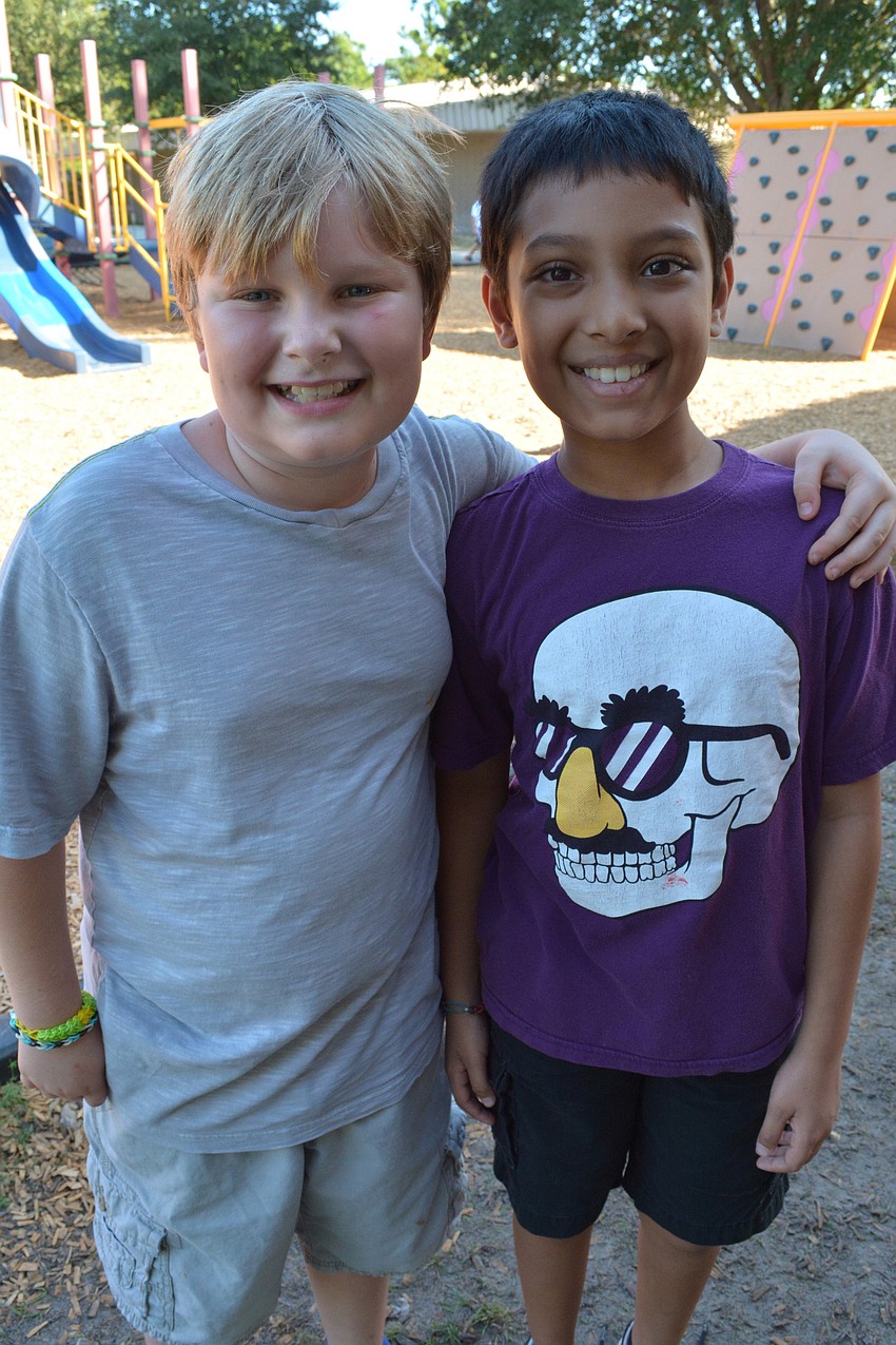 Marco Satira and Jonathan Xavioer walked laps together.