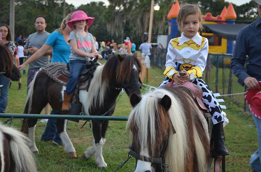 Isabella Hackett rides a pony.