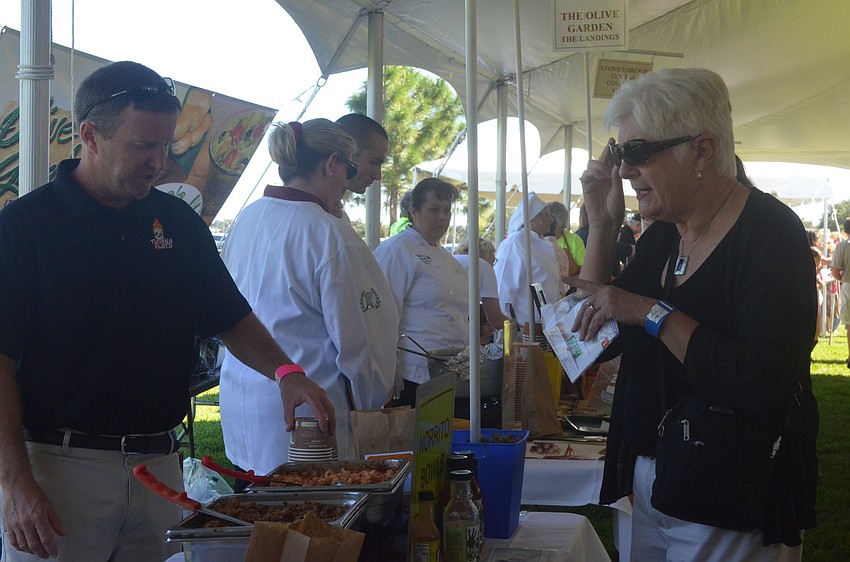 Linda Kocourek checks out Tijuana Flatâ€™s booth