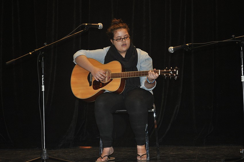 Kylee Follett sings and plays the keyboard. Today, she played the guitar.
