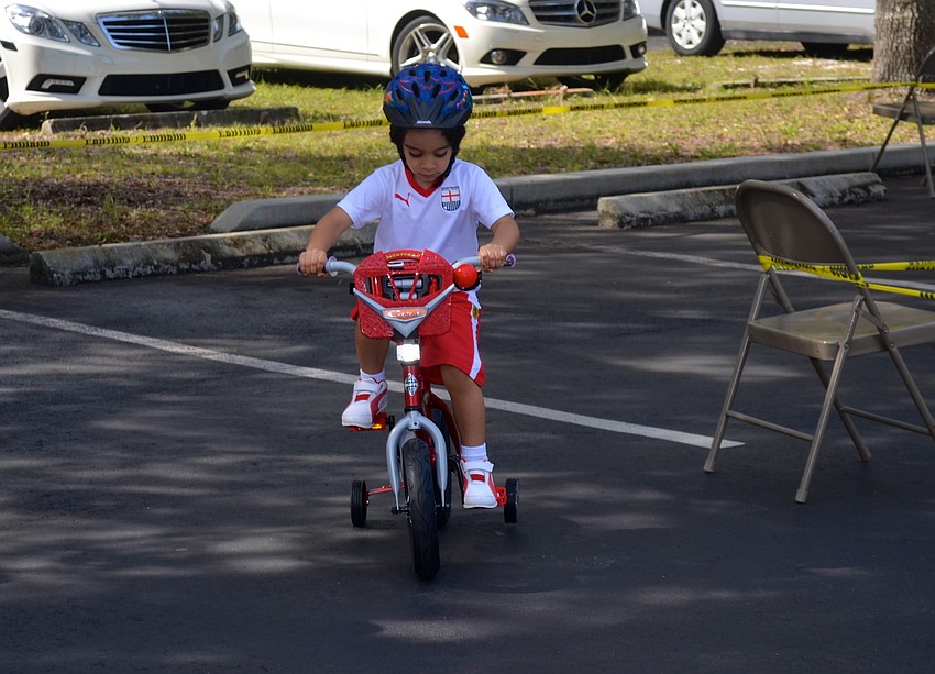 Haiel Suwaity, 3, watches how fast his feet can go.