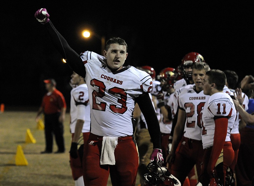 Cardinal Mooney junior tight end Mitch Arimura celebrates a defensive stand in the fourth quarter.