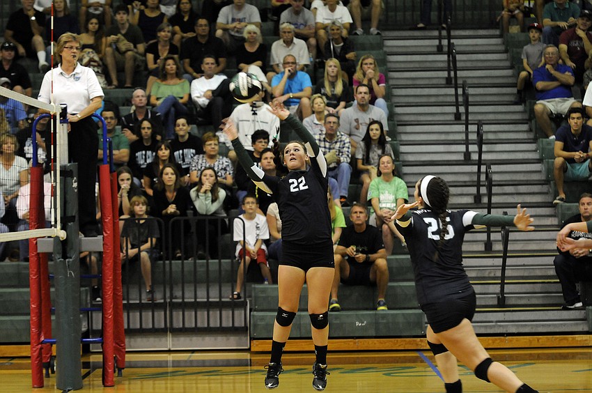 Lakewood Ranch senior setter Ali Milbourn sends the ball back over the net for a point in the first set.