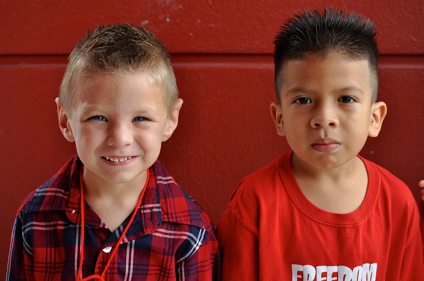 Logan Mclod, 5, and Maurio Hernandez, 6, enjoy the dayâ€™s events.