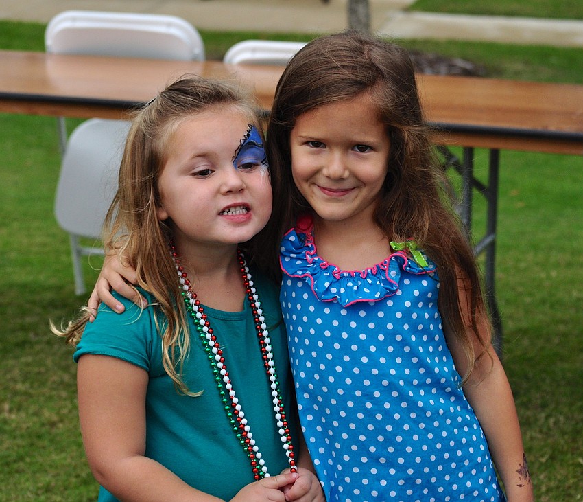Isabella Violetto, 4, and Emma Rodman, 6, enjoy the day's festivities.