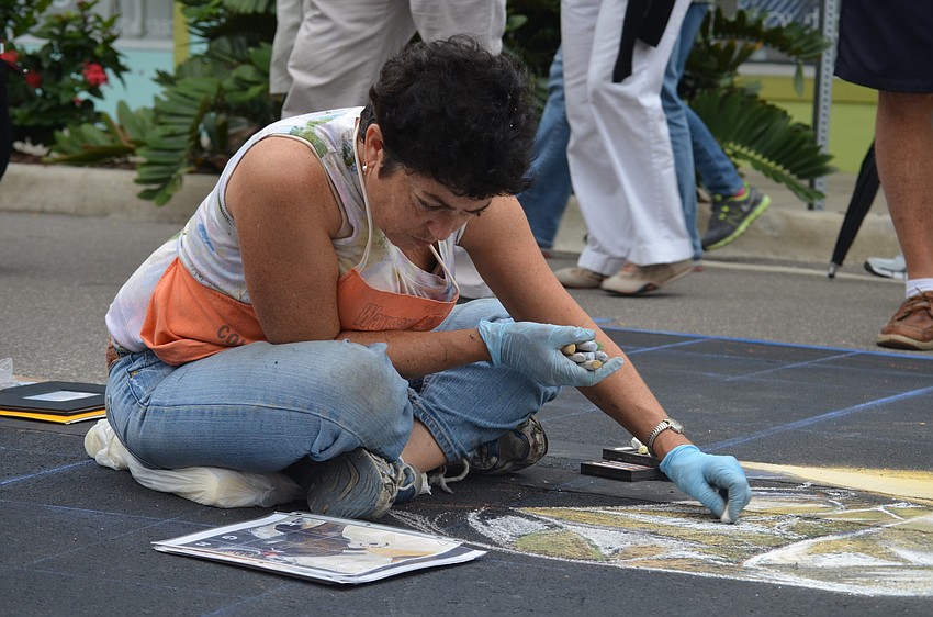 Lori Escalera works on her piece