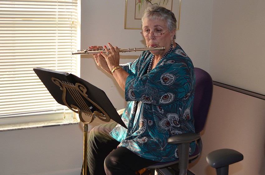 Evelyn Miller played the flute during the Volunteer Appreciation Tea.