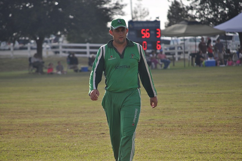 A Cayman Islandsâ€™ fielder walked back to his spot on the field.