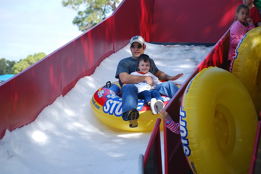 Children and adults enjoy the three-ton snow slide.