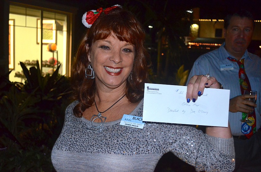 Debbie Anglin wins for best sweater.