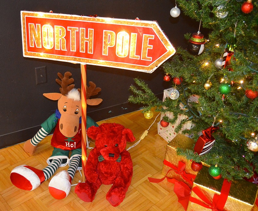 Stuffed animals, a decorated tree and a North Pole sign lead the way for the special guest.