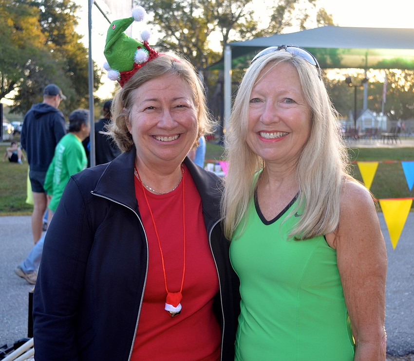 Janie Denmant and Kathy Dubro dress festive.