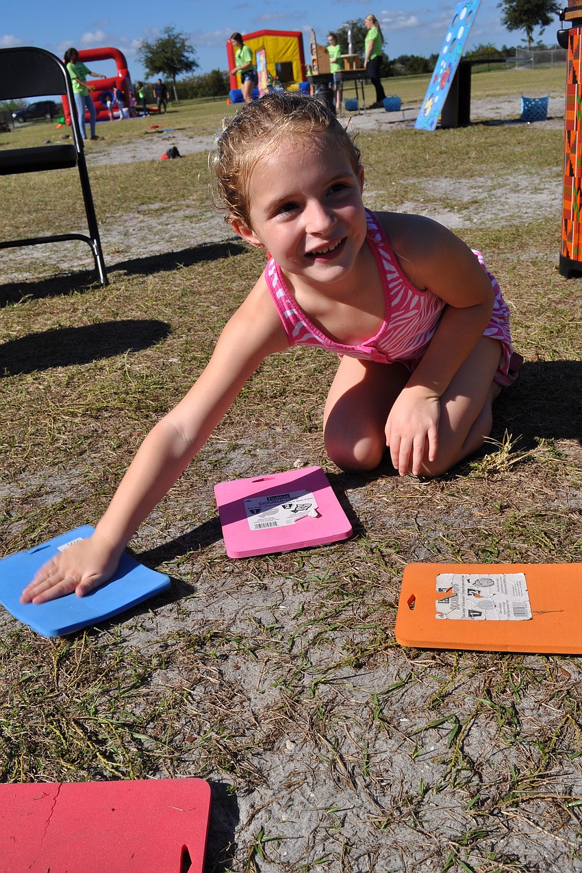 Lily Grigsby, 6, controls instruments at the drum circle.