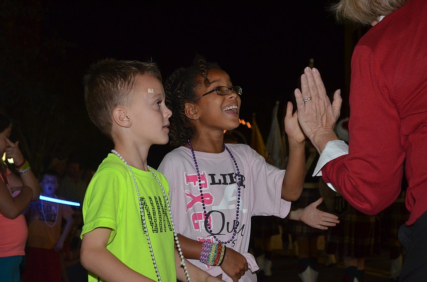 Adam Batko and Jaelen Hebden get high-fived
