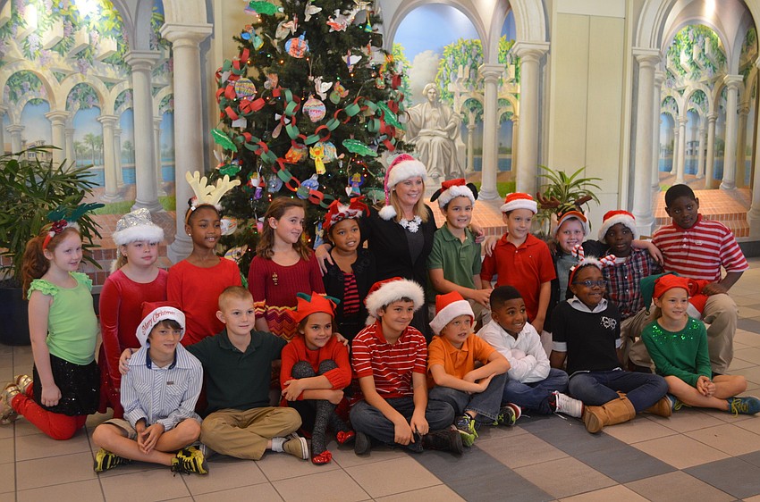 Mrs. Owenâ€™s third-grade class dressed as reindeer, elves and santas
