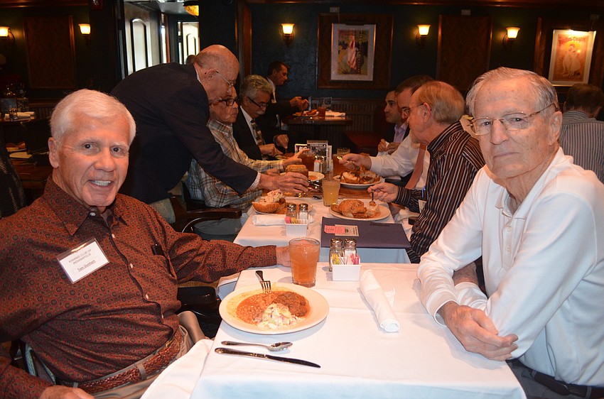 Tom Dunham, a visiting Kiwanian from Indianapolis, sits with Jack Floyd.