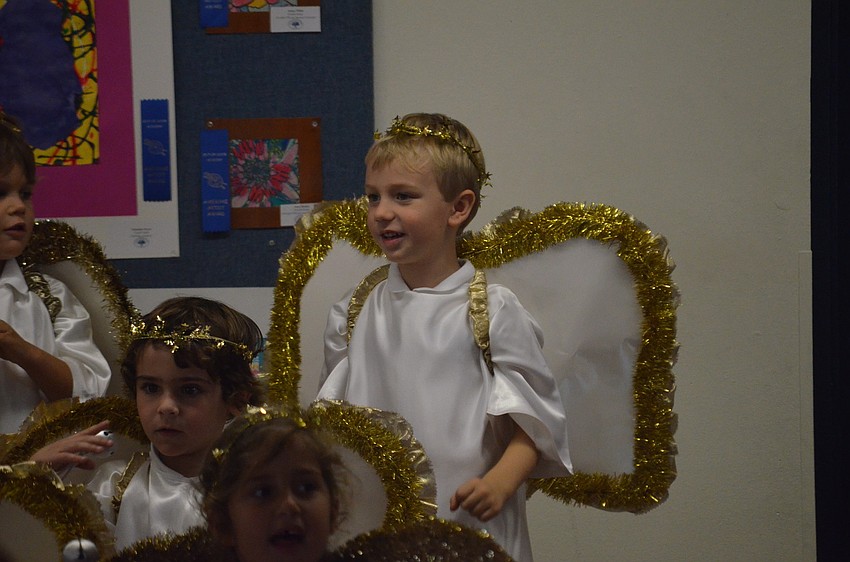 Hayne F. sings as an angel.