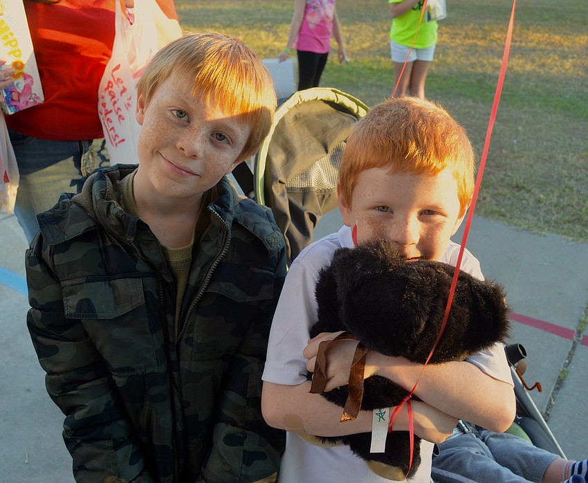 The Braden boys, Damien, 9, and Trace, 7, enjoy time with friends.