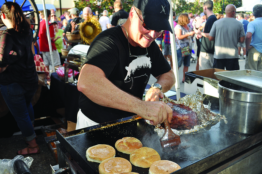 Polo Grill and Bar owner Tommy Klauber works the grill to compete for the title of 