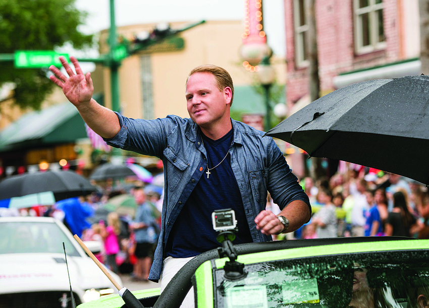East County resident Nik Wallenda waves to Sarasotans, who welcomed him home after he crossed the Grand Canyon, during the Suncoast Super Boat Grand Prix Festival Parade of Boats July 3.