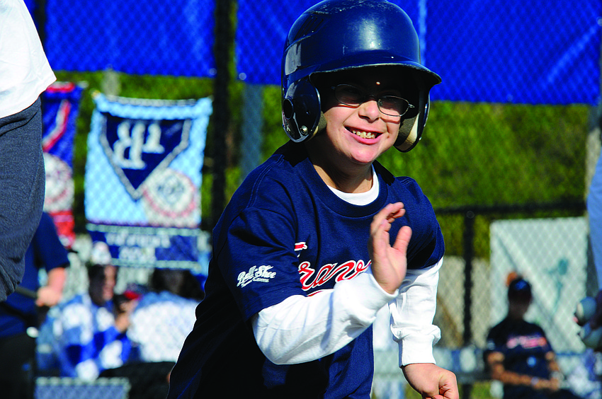 Payton Aaron couldn't contain his enthusiasm as he raced down the first-base line during the Miracle League of Manasota's season opener March 16.