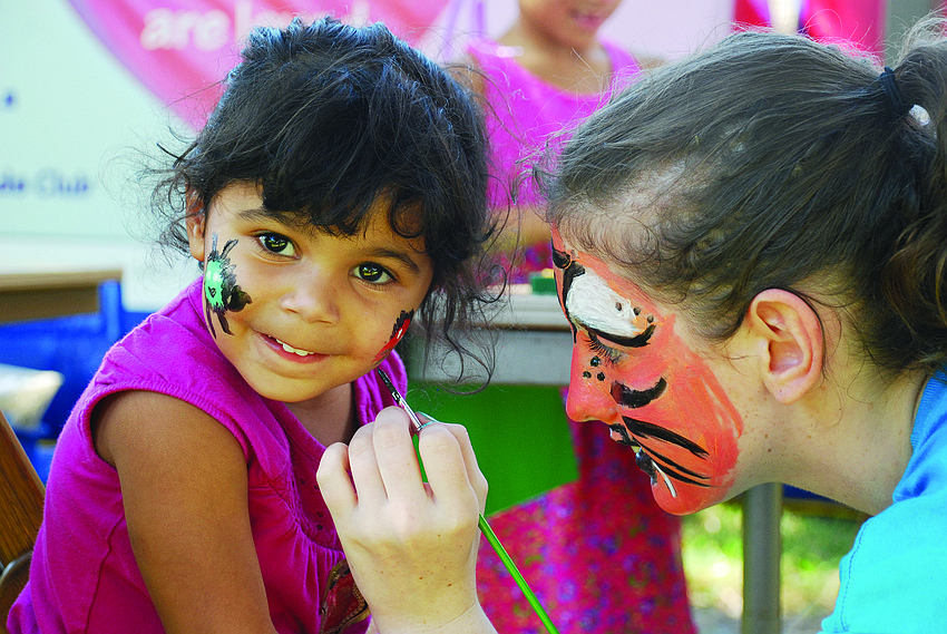 Jolie Banks gets her face painted at St. Andrew United Church of Christ during its third annual Gulf Gate Festival Dec. 7.