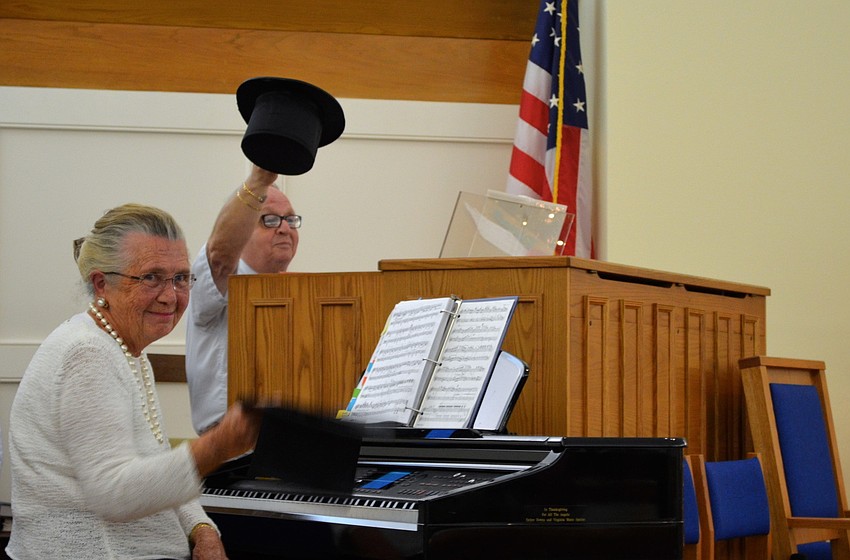 Sylvia Thompson and Dale Hooey tip their hats after the final song.