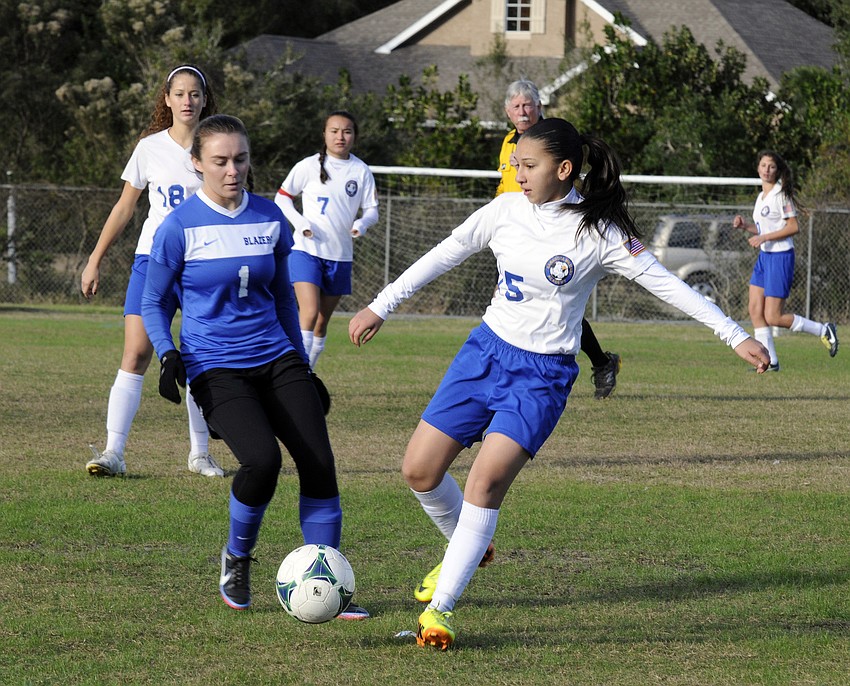 SMAâ€™s Daniela Romero attempts to maneuver the ball past Sarasota Christianâ€™s Cecelia Genson.