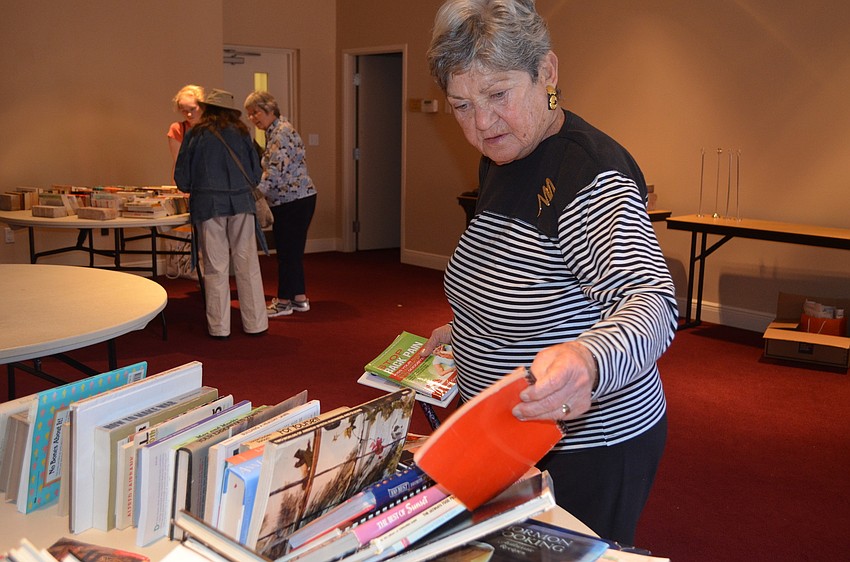 Marilyn Buxton searches for books at the festivalâ€™s book sale.