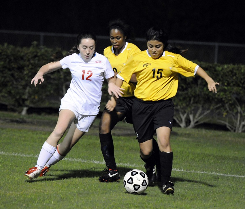 Cardinal Mooneyâ€™s Farrah Nelson and Booker Highâ€™s Karla Gonzalaz fight for possession early in the first half.