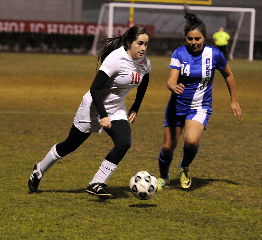 Cardinal Mooney midfielder Jill Polk pushes the ball up the field midway through the first half.
