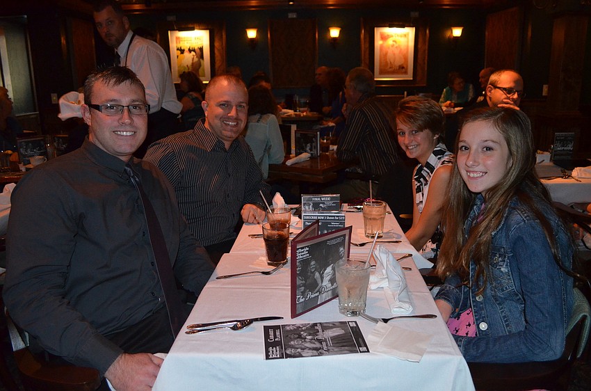 Shay and Kiragen Benhaus sit with Brett and Joy Beauchamp. Both Kiragen and Joy chose to wear comfortable dresses.