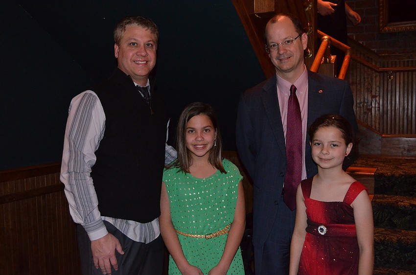 Natalie and Scott Rogers with Kiwanis Club President John Moore and daughter Katherine.