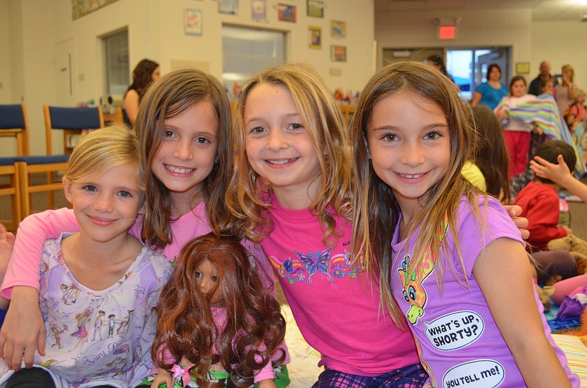 Alyssa Wright, 7, Sophie Buchmeier, 8, Courtney Bates, 8 and Jamie Demert, 8, sit together for the evening.