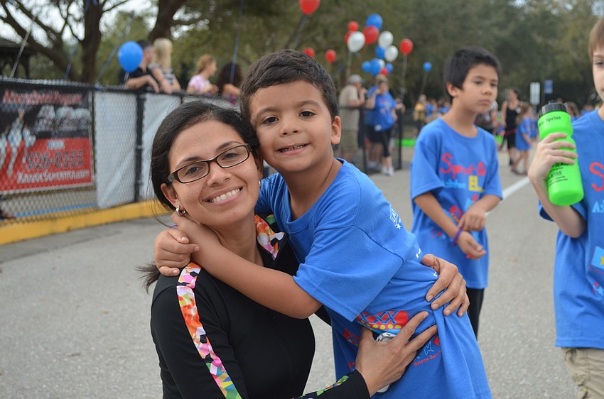 Violeta and Nicolas Guzman take a break from running.