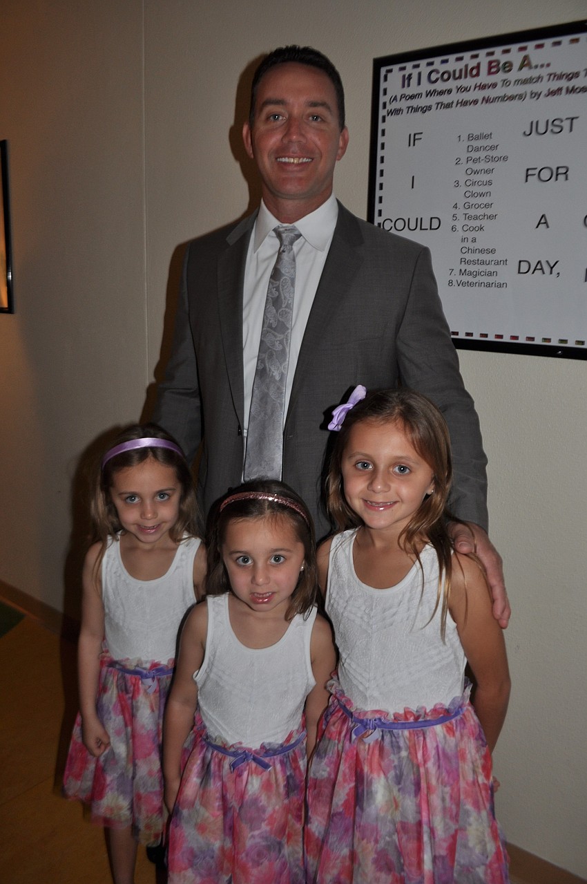 Mike Griffin brings his three daughters, Maya, Julia and Alexandra.