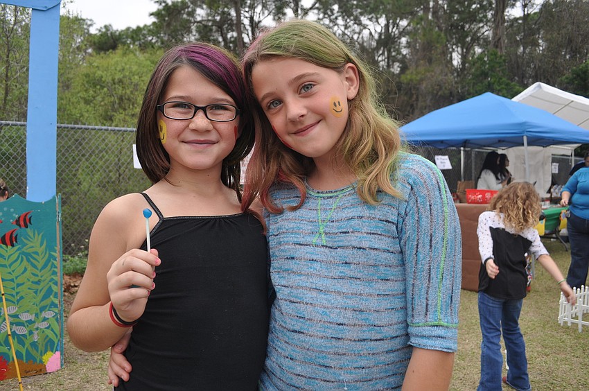Third graders Chesnee Darlus and Cydney Forsyth enjoyed getting their faces painted and hairs dyed.