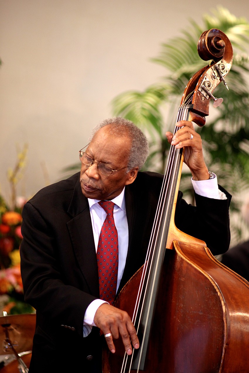 John Lamb plays bass during the service.