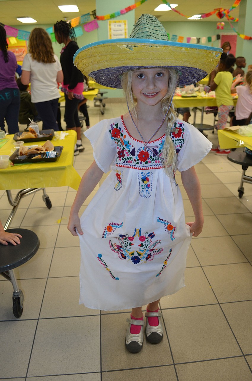Lila Burgess wears a dress from Spain.