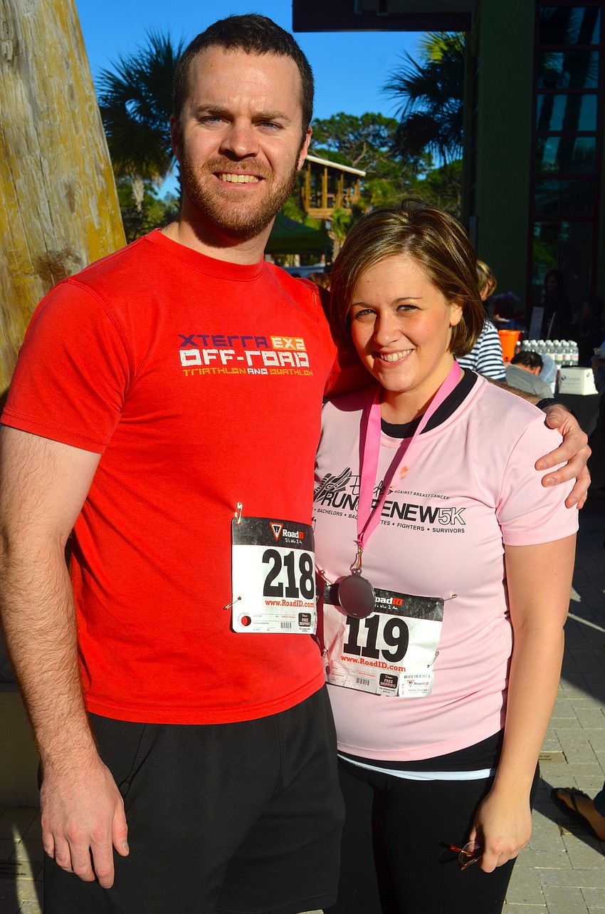 Todd Mullaney and Mya Widruyer rest after their run.