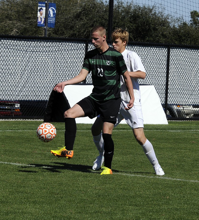 Lakewood Ranch sophomore Reese Riggins holds off a Melbourne defender for possession in the second half.