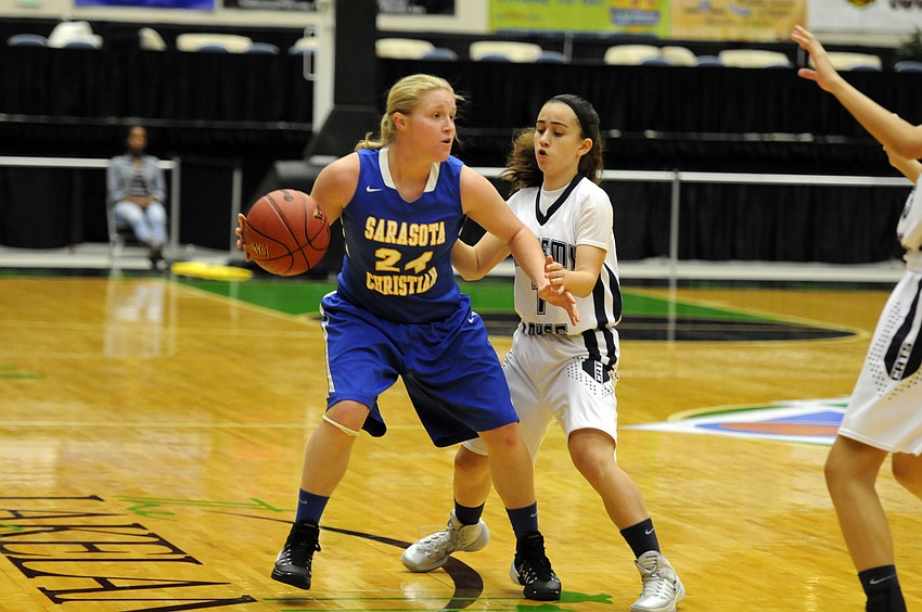 Sarasota Christian guard Megan Garriott looks for an open teammate in the first quarter.
