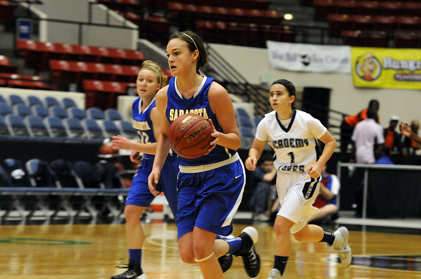 Sarasota Christianâ€™s Andrea Wittmer brings the ball down the court in the fourth quarter.