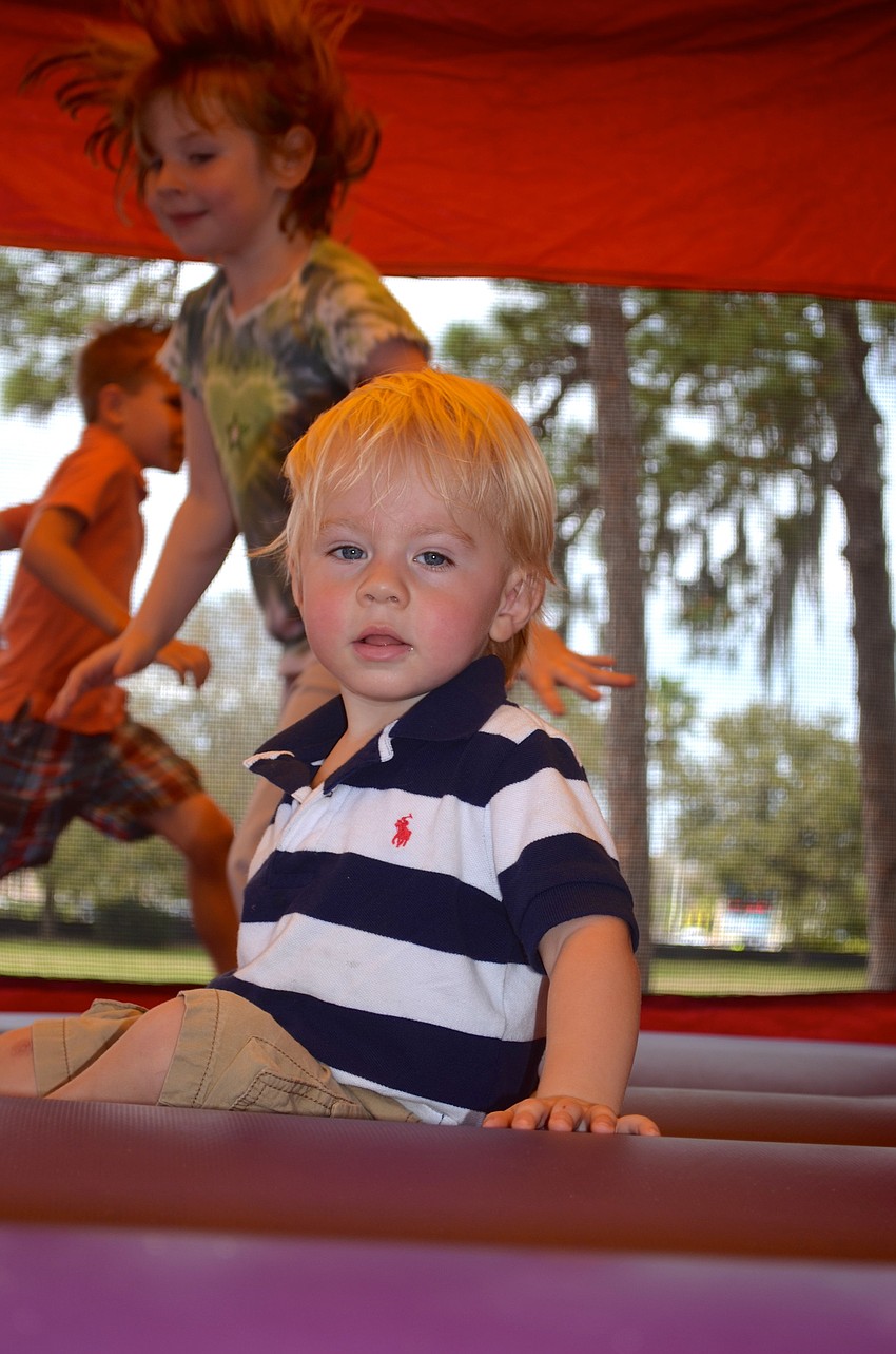 Jaxson Wirth, 2, takes a break, while Samantha Berry, 5, is just getting warmed up.